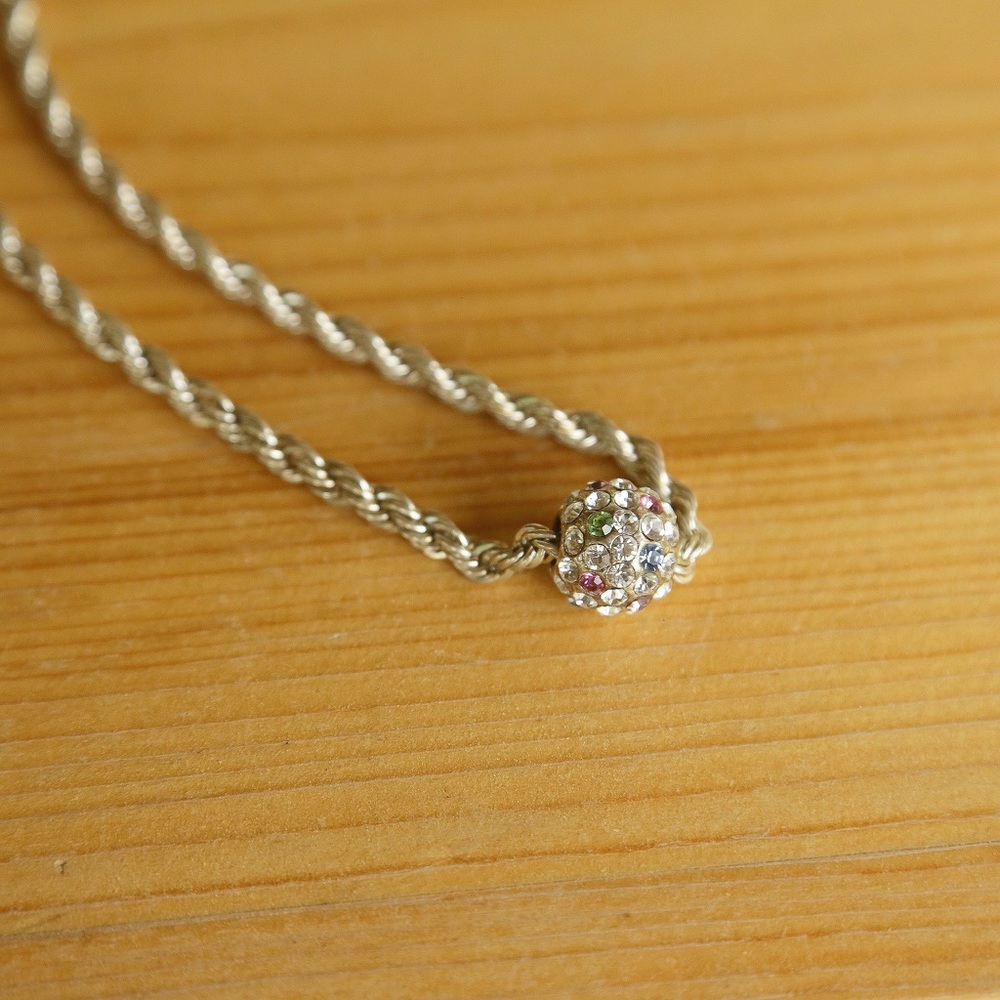 silver necklace with charm